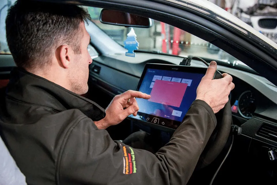 Car key being diagnosed with a programming tablet