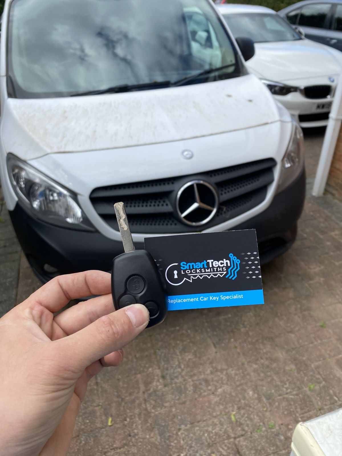 Mercedes Citan van key cut and coded in Havant by SmartTech Auto Locksmiths, key and business card held in front of the vehicle
