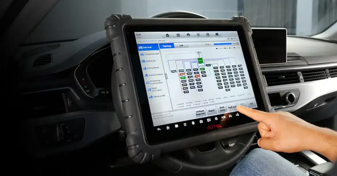 Key programming software running on a laptop in a car