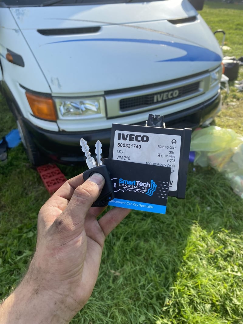 Iveco Daily van ignition and key in Netley & Hamble by SmartTech Auto Locksmiths, key and business card held in front of the vehicle