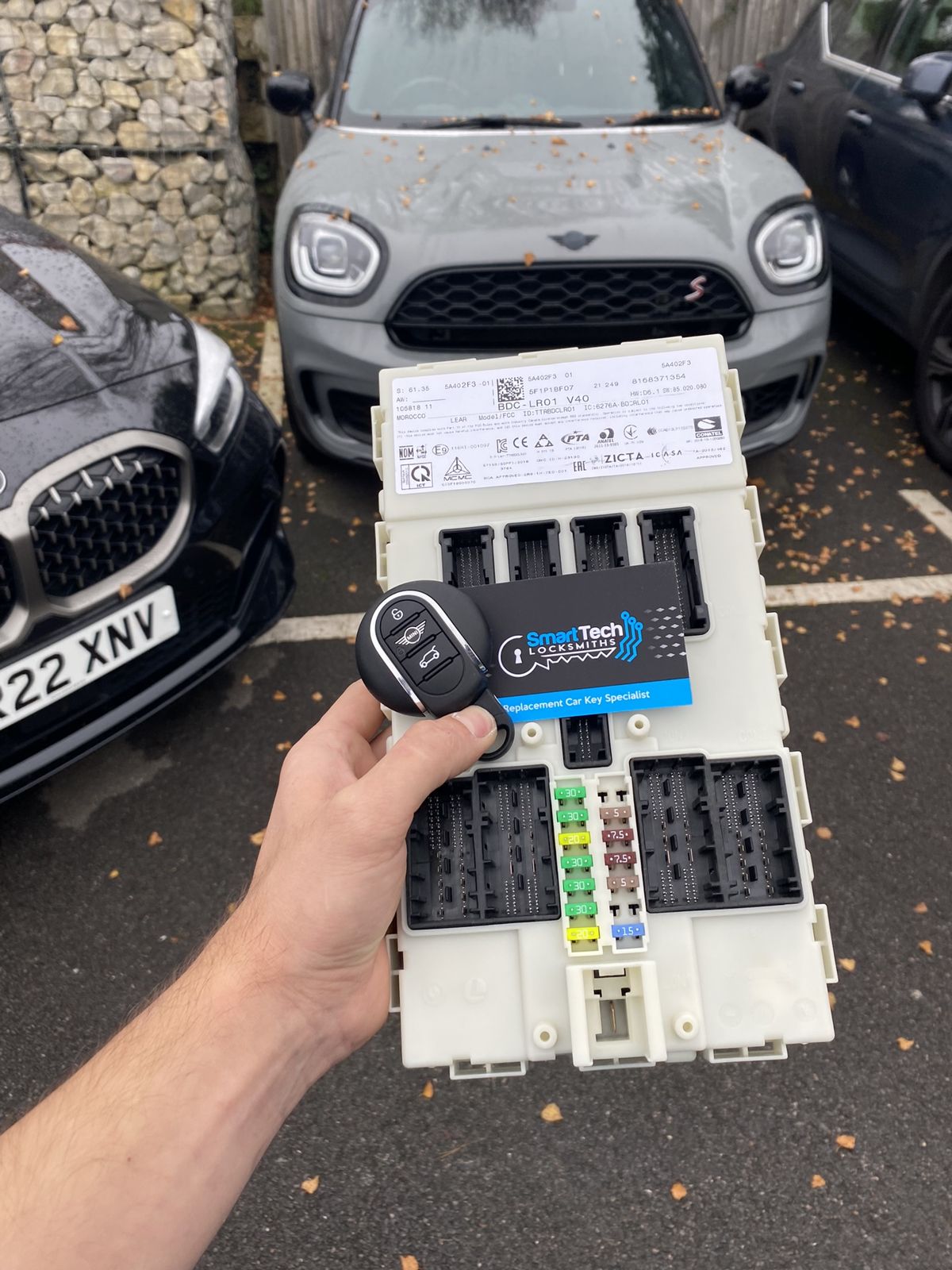 Mini Countryman all keys lost, module coded in Ringwood by SmartTech Auto Locksmiths, key and business card held in front of the vehicle